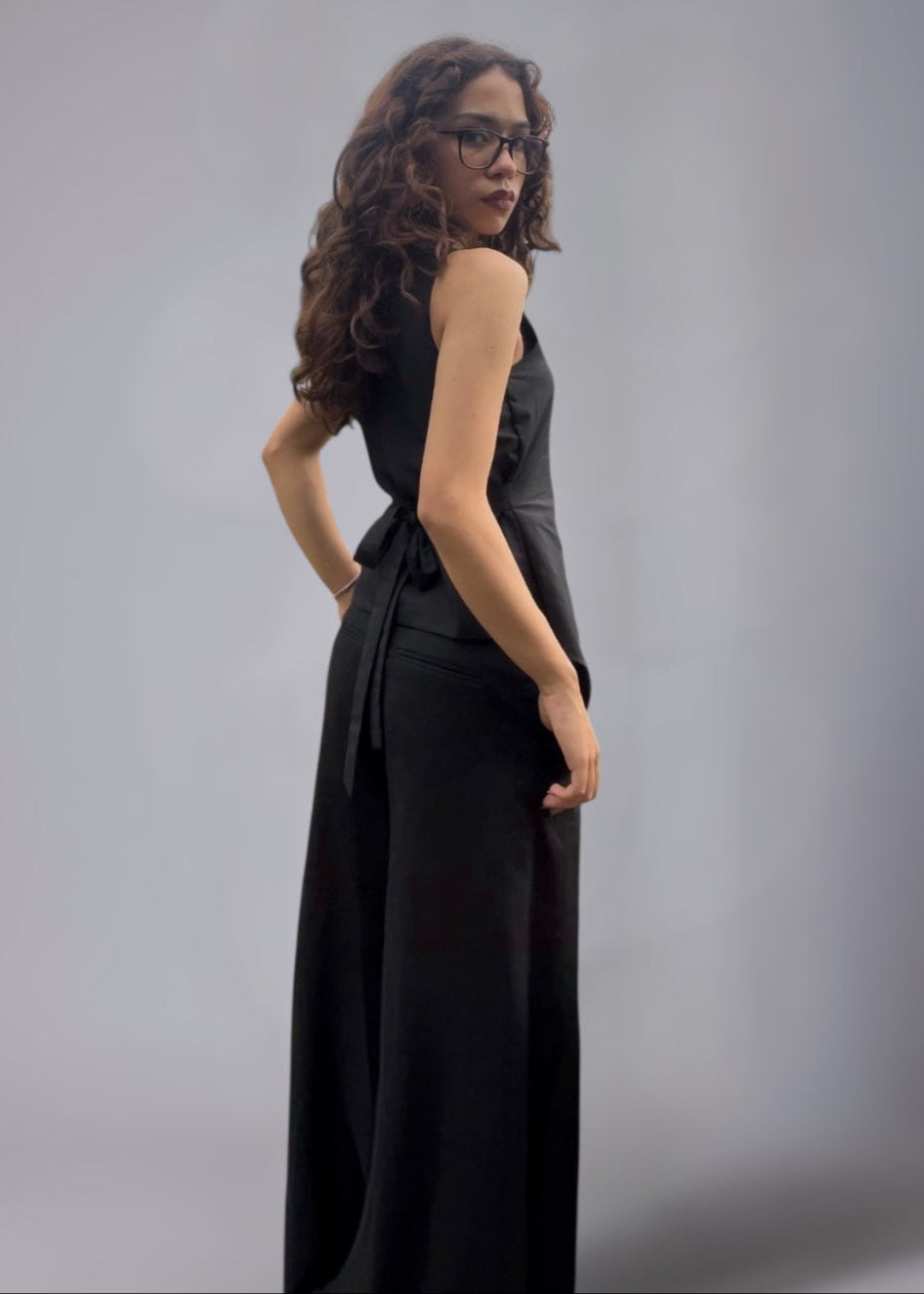 Black asymmetrical terry cotton co-ord set with tie-up waist and wide leg tailored pants.