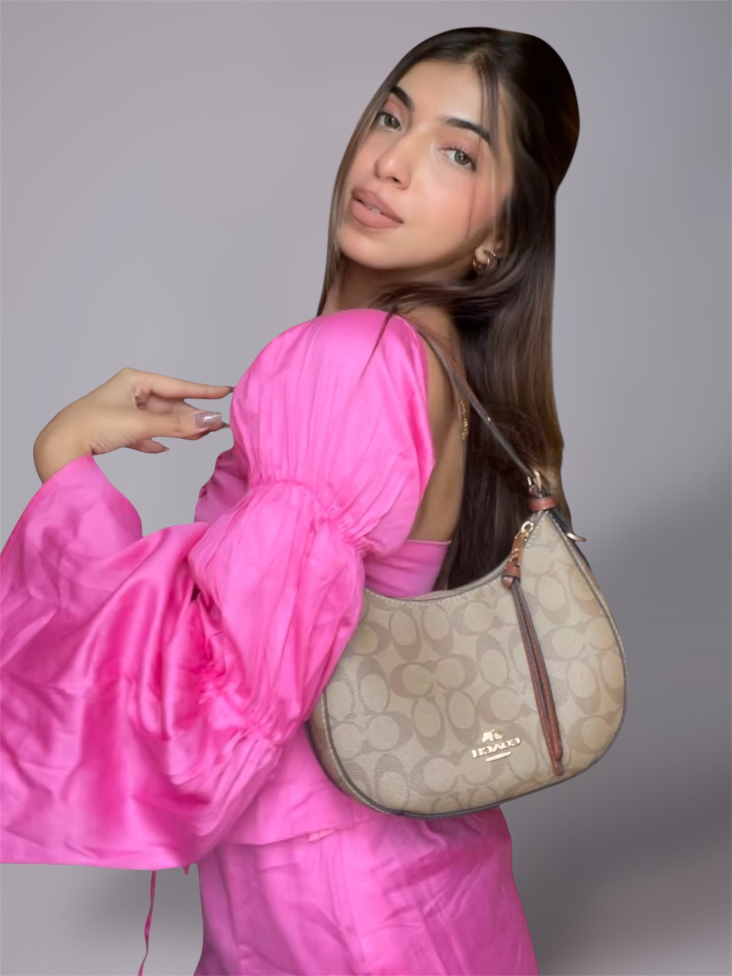 Woman wearing long puff sleeve pink top and mini slit skirt