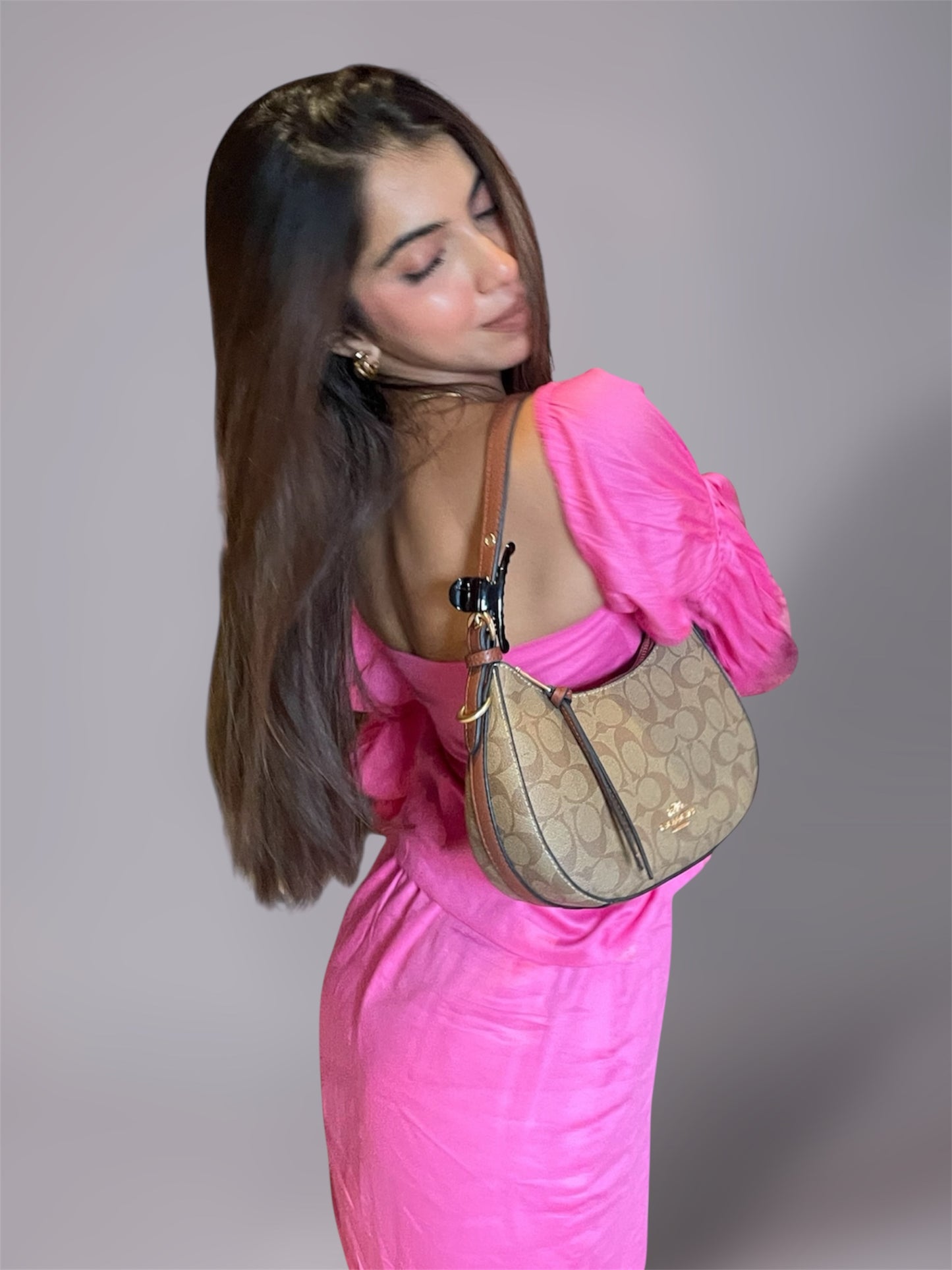 Woman wearing long puff sleeve pink top and mini slit skirt