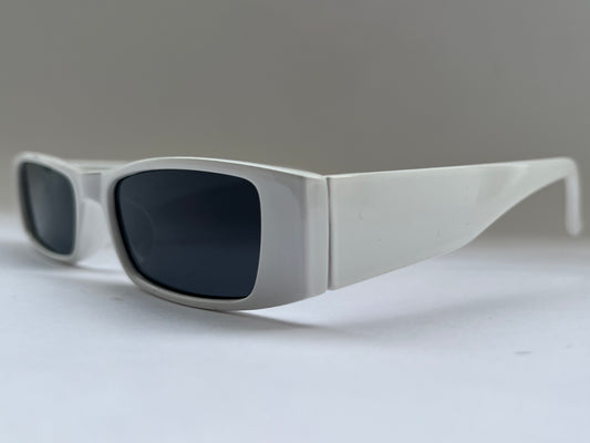 Sunglasses with dark lenses and white frame background