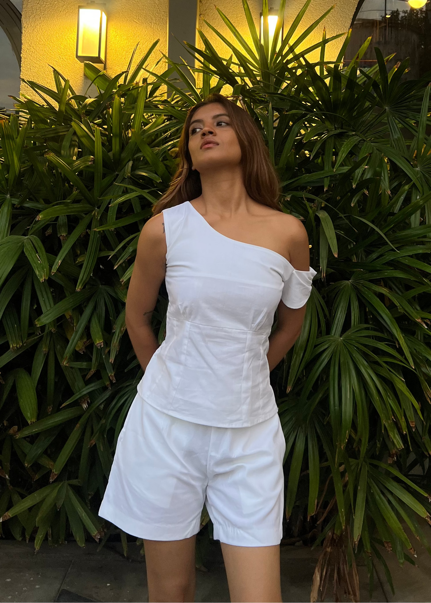 white co-ord set for women, crafted in 100% breathable bamboo cotton, structured asymmetrical one-shoulder top with side zip with relaxed-fit shorts WITH POCKETS and comfortable waistband