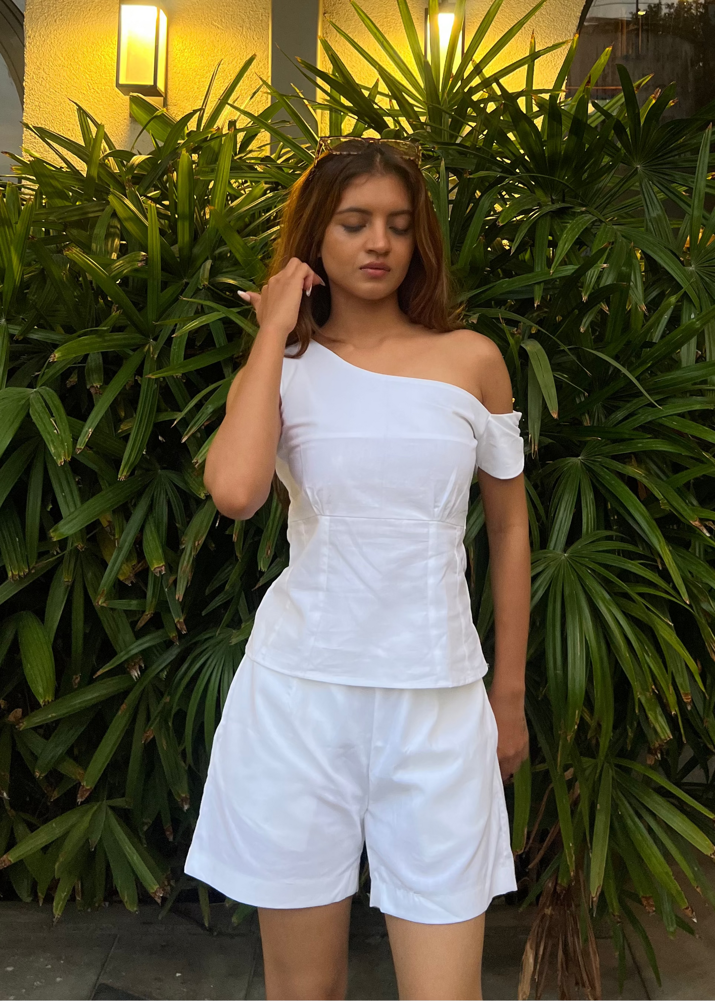 white co-ord set for women, crafted in 100% breathable bamboo cotton, structured asymmetrical one-shoulder top with side zip with relaxed-fit shorts WITH POCKETS and comfortable waistband