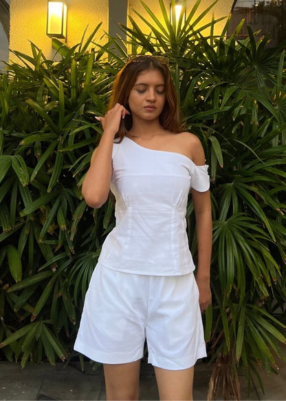 white co-ord set for women, crafted in 100% breathable bamboo cotton, structured asymmetrical one-shoulder top with side zip with relaxed-fit shorts WITH POCKETS and comfortable waistband