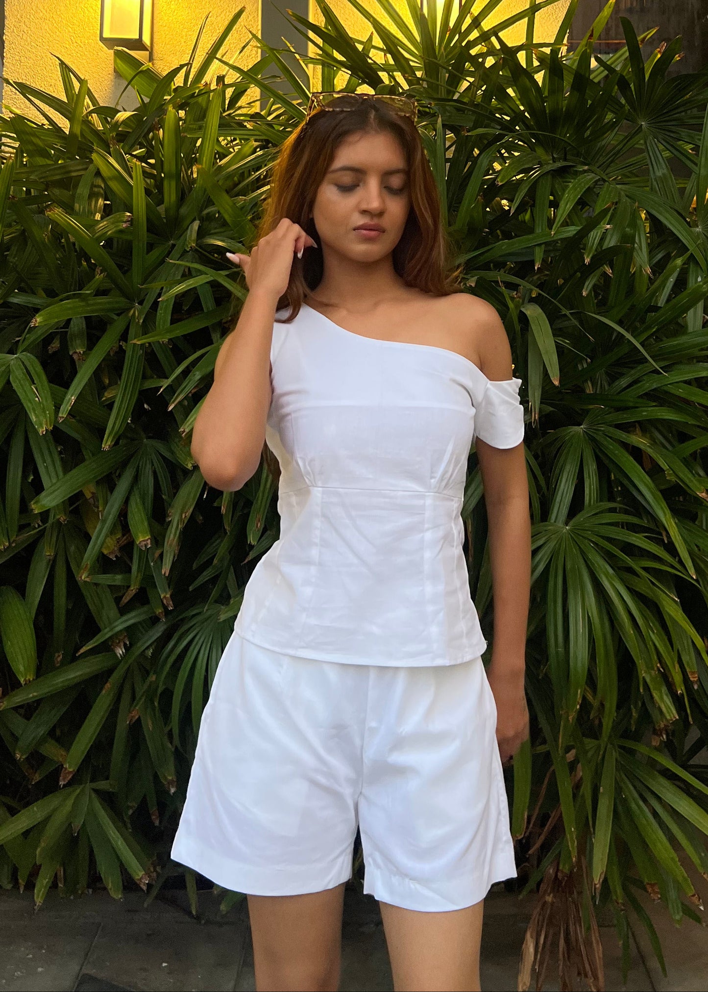 white co-ord set for women, crafted in 100% breathable bamboo cotton, structured asymmetrical one-shoulder top with side zip with relaxed-fit shorts WITH POCKETS and comfortable waistband