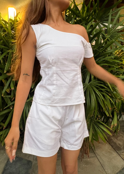 white co-ord set for women, crafted in 100% breathable bamboo cotton, structured asymmetrical one-shoulder top with side zip with relaxed-fit shorts WITH POCKETS and comfortable waistband