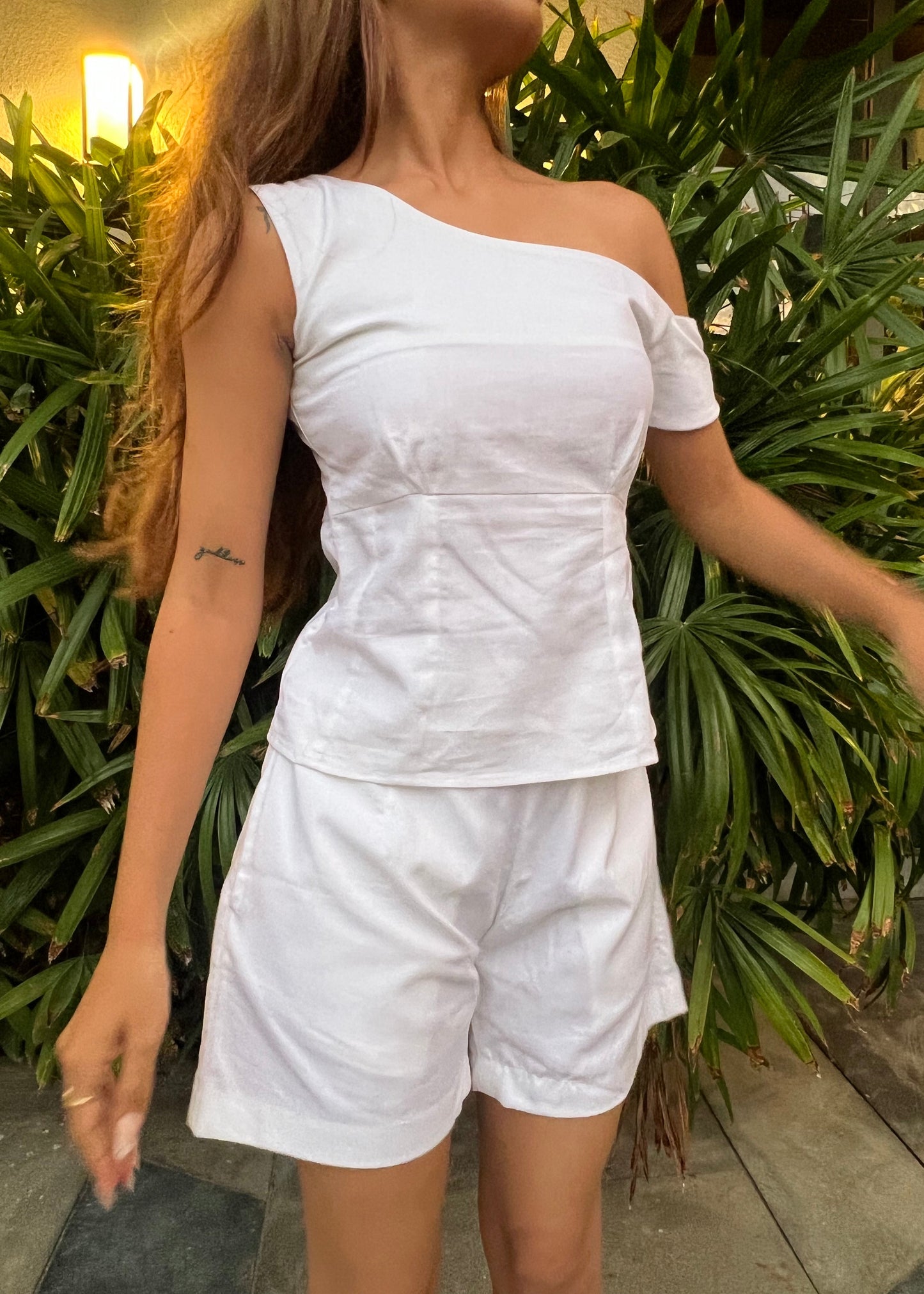 white co-ord set for women, crafted in 100% breathable bamboo cotton, structured asymmetrical one-shoulder top with side zip with relaxed-fit shorts WITH POCKETS and comfortable waistband