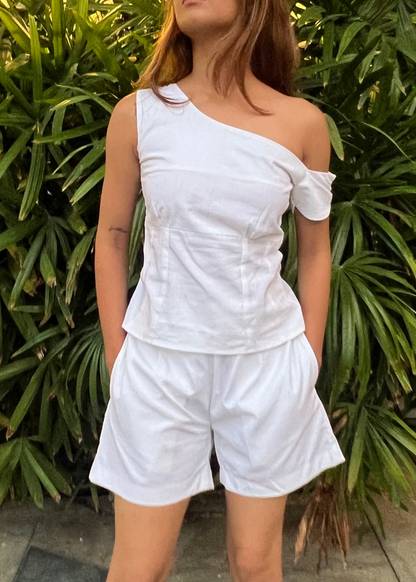 white co-ord set for women, crafted in 100% breathable bamboo cotton, structured asymmetrical one-shoulder top with side zip with relaxed-fit shorts WITH POCKETS and comfortable waistband