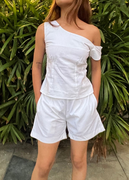 white co-ord set for women, crafted in 100% breathable bamboo cotton, structured asymmetrical one-shoulder top with side zip with relaxed-fit shorts WITH POCKETS and comfortable waistband