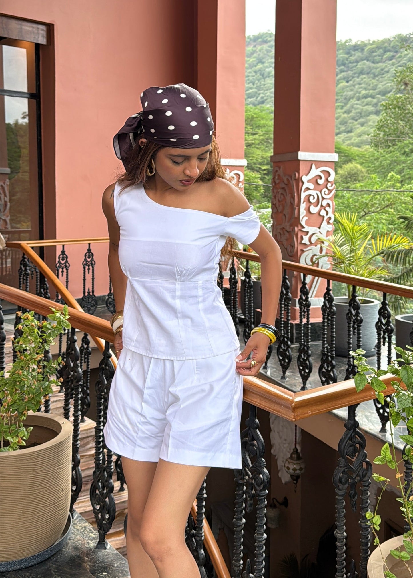 white co-ord set for women, crafted in 100% breathable bamboo cotton, structured asymmetrical one-shoulder top with side zip with relaxed-fit shorts WITH POCKETS and comfortable waistband