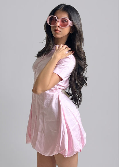 women wearing a pink bubble hem cotton dress with short sleeves and A-line silhouette from Hyghbreed